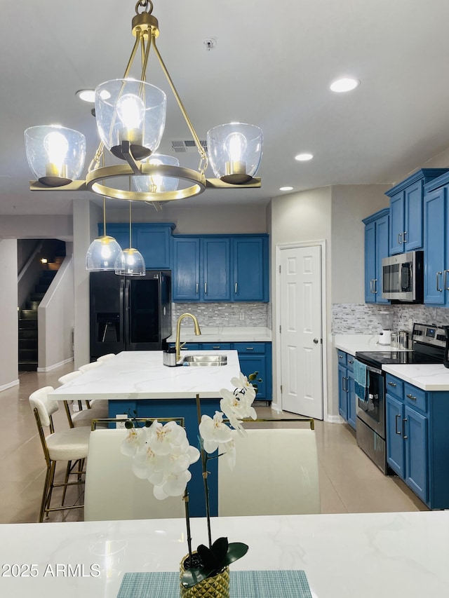 7136 N 73rd Dr, Glendale, AZ 85303 - kitchen with tasteful backsplash, appliances with stainless steel finishes, blue cabinets, and a sink