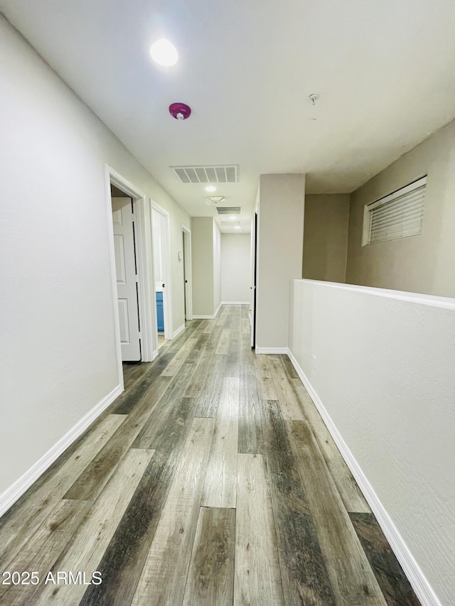 7136 N 73rd Dr, Glendale, AZ 85303 - hallway with visible vents, baseboards, and hardwood / wood-style floors