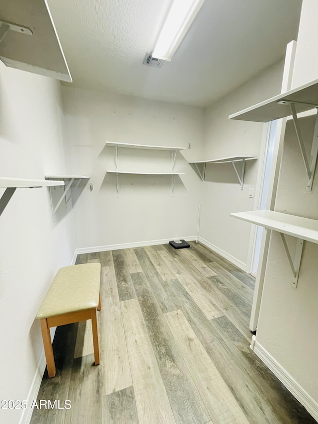 7136 N 73rd Dr, Glendale, AZ 85303 - spacious closet with wood finished floors and visible vents
