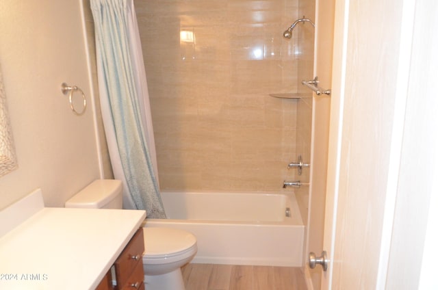 full bathroom with hardwood / wood-style flooring, vanity, toilet, and shower / bath combo