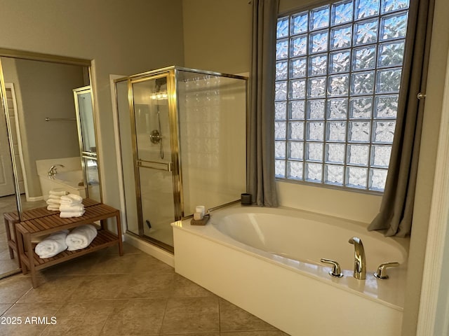 bathroom featuring separate shower and tub and tile patterned flooring