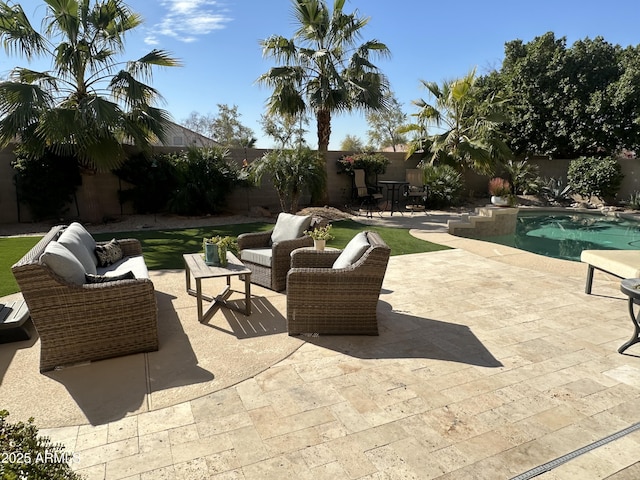 view of patio / terrace featuring an outdoor hangout area and a fenced in pool