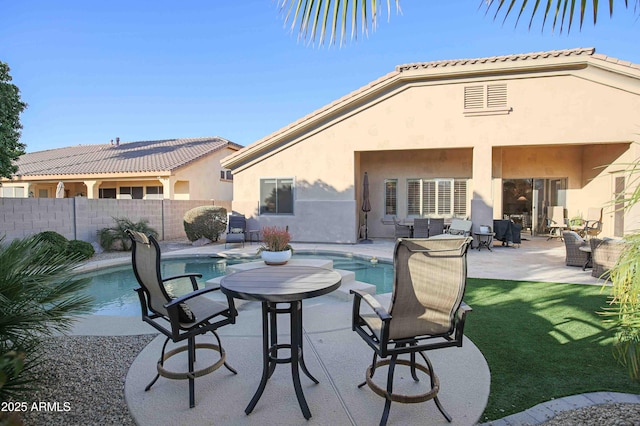 view of patio with a fenced in pool