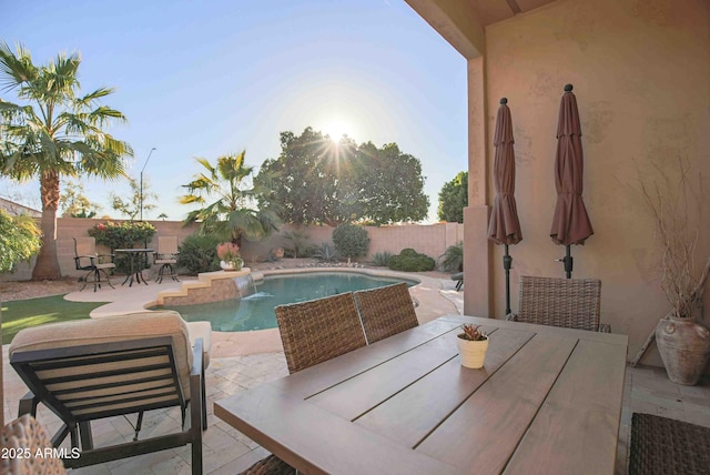 view of swimming pool with a patio and pool water feature