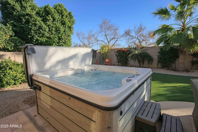 exterior space featuring a hot tub