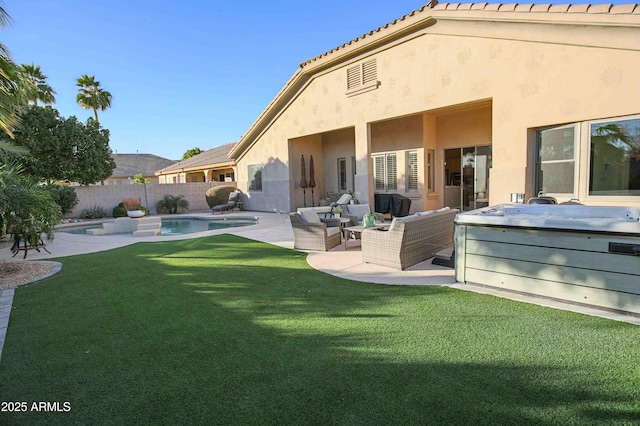 rear view of property with a pool with hot tub, an outdoor living space, a yard, and a patio area