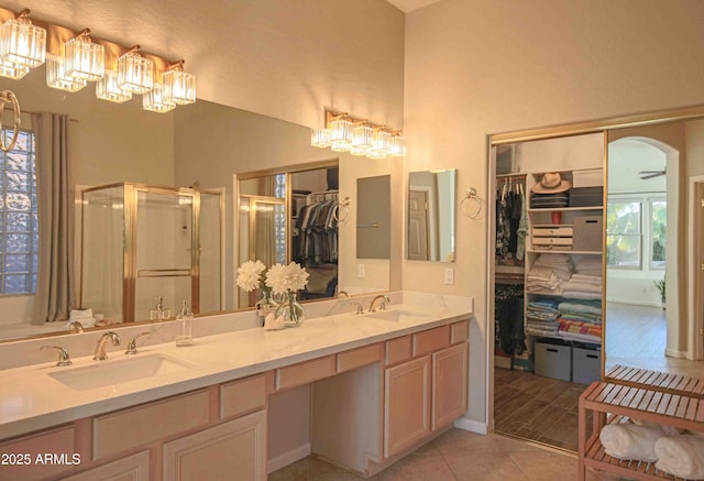 bathroom with vanity, tile patterned floors, and a shower with shower door