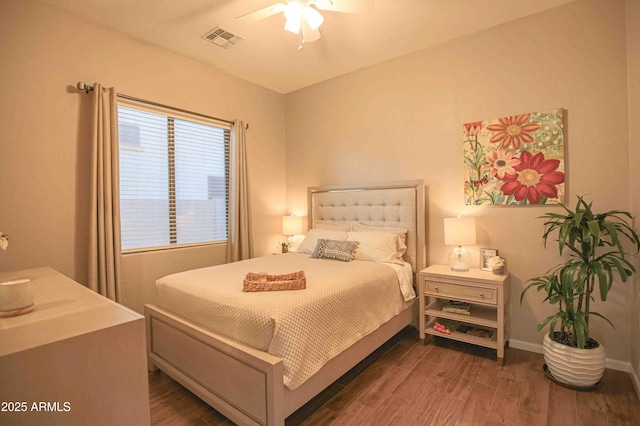 bedroom featuring dark wood-type flooring and ceiling fan