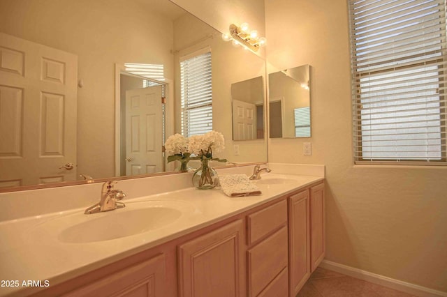 bathroom with tile patterned flooring and vanity