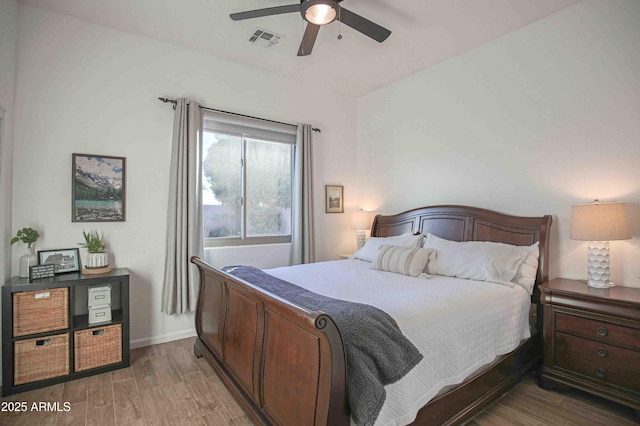 bedroom featuring wood-type flooring and ceiling fan