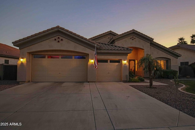 mediterranean / spanish-style house featuring a garage