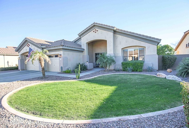 mediterranean / spanish-style house featuring a garage, cooling unit, and a front lawn