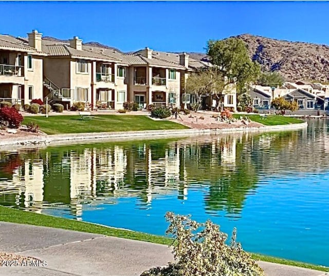 view of water feature featuring a mountain view and a residential view