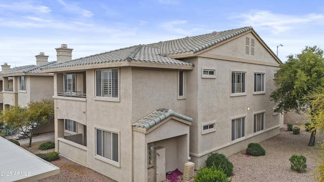16013 S Desert Foothills Pkwy Unit 2120, Phoenix, AZ 85048 - exterior space featuring a tiled roof, a chimney, and stucco siding
