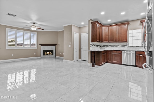 16013 S Desert Foothills Pkwy Unit 2120, Phoenix, AZ 85048 - kitchen with visible vents, crown molding, baseboards, ceiling fan, and appliances with stainless steel finishes