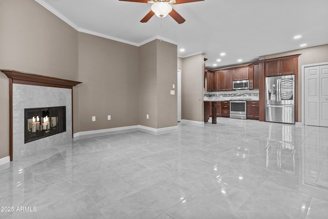 16013 S Desert Foothills Pkwy Unit 2120, Phoenix, AZ 85048 - unfurnished living room featuring crown molding, baseboards, ceiling fan, a tiled fireplace, and marble finish floor