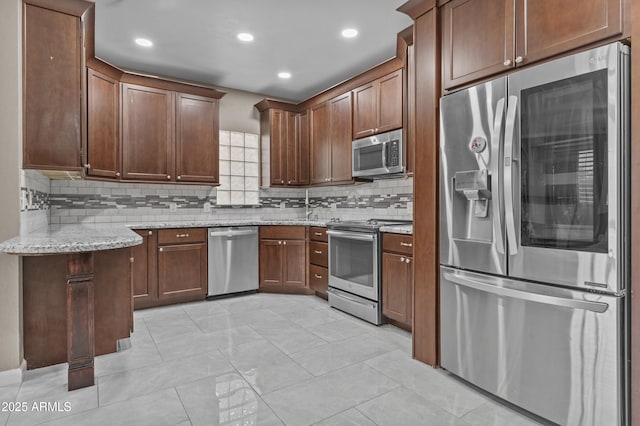 16013 S Desert Foothills Pkwy Unit 2120, Phoenix, AZ 85048 - kitchen with light stone countertops, recessed lighting, a sink, stainless steel appliances, and tasteful backsplash