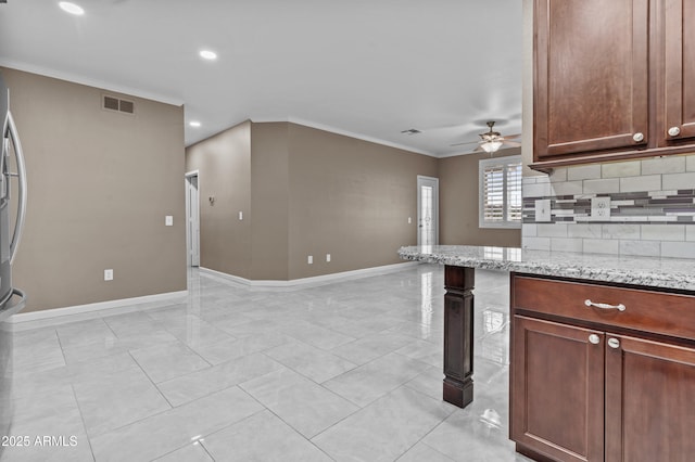 16013 S Desert Foothills Pkwy Unit 2120, Phoenix, AZ 85048 - kitchen featuring visible vents, tasteful backsplash, crown molding, baseboards, and ceiling fan