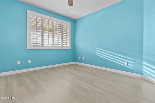 16013 S Desert Foothills Pkwy Unit 2120, Phoenix, AZ 85048 - empty room featuring wood finished floors, baseboards, and ceiling fan