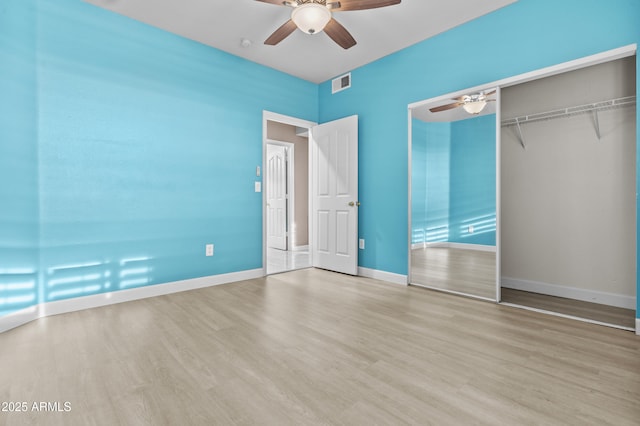 16013 S Desert Foothills Pkwy Unit 2120, Phoenix, AZ 85048 - unfurnished bedroom with visible vents, baseboards, wood finished floors, a closet, and a ceiling fan