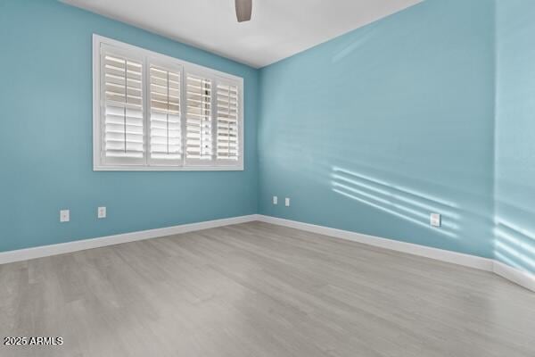 16013 S Desert Foothills Pkwy Unit 2120, Phoenix, AZ 85048 - empty room with baseboards, a ceiling fan, and wood finished floors