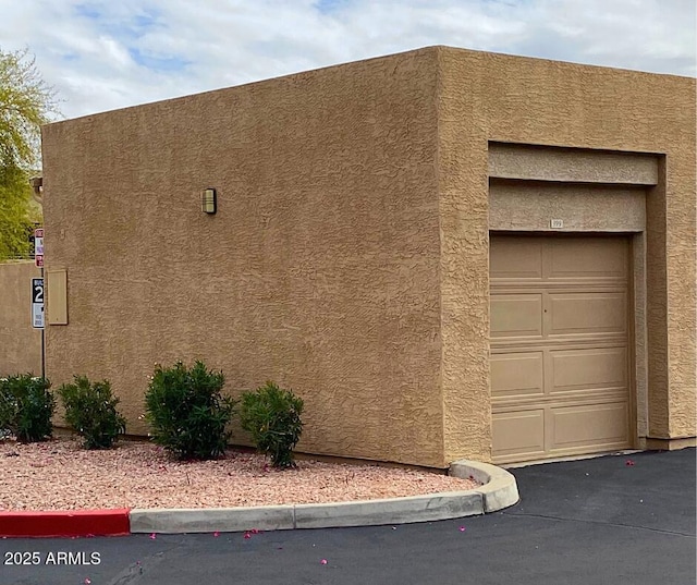 view of side of home featuring stucco siding