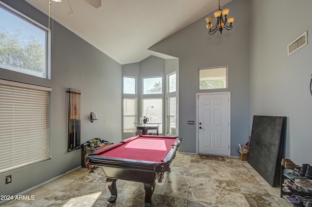 rec room featuring ceiling fan with notable chandelier, high vaulted ceiling, and billiards