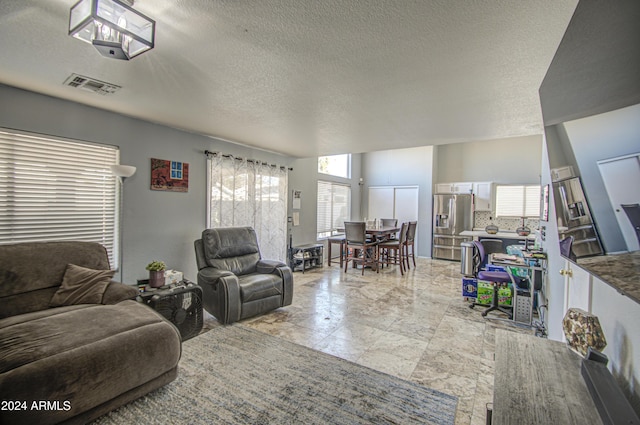 living room featuring a textured ceiling