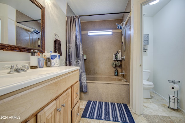 full bathroom with shower / bath combo with shower curtain, vanity, a textured ceiling, and toilet