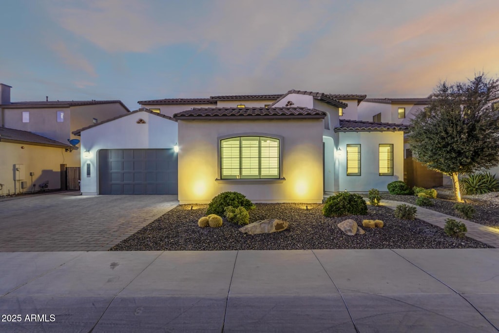 mediterranean / spanish-style house featuring a garage