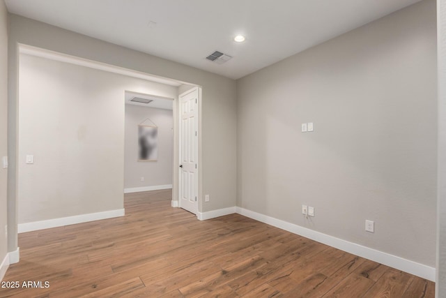 40470 W Agave Rd, Maricopa, AZ 85138 - spare room featuring baseboards, light wood finished floors, and recessed lighting