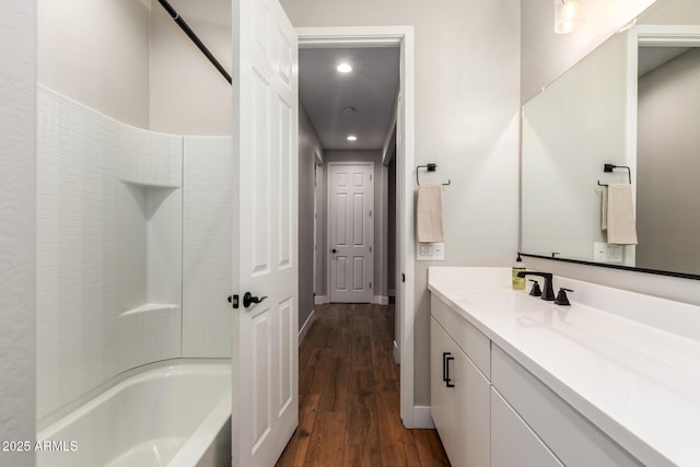 40470 W Agave Rd, Maricopa, AZ 85138 - full bathroom with vanity, wood finished floors, bathing tub / shower combination, recessed lighting, and baseboards