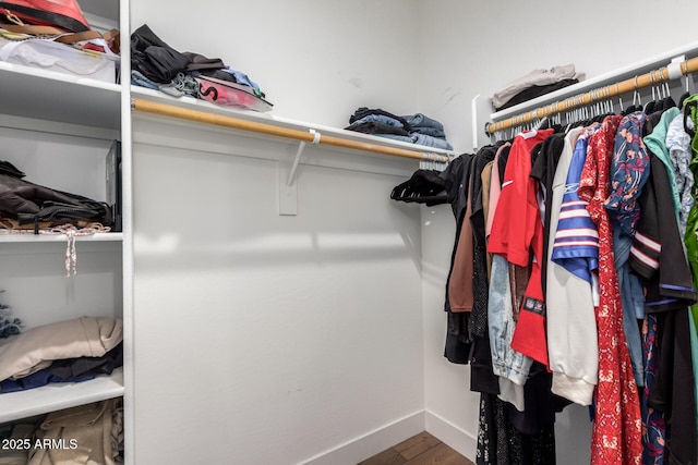 40470 W Agave Rd, Maricopa, AZ 85138 - spacious closet featuring wood finished floors