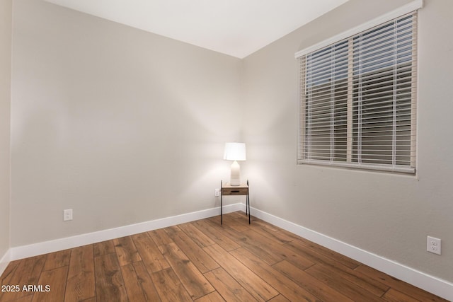 40470 W Agave Rd, Maricopa, AZ 85138 - empty room featuring baseboards and wood finished floors