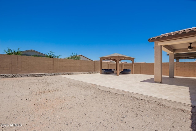 40470 W Agave Rd, Maricopa, AZ 85138 - fenced backyard featuring a patio area and ceiling fan