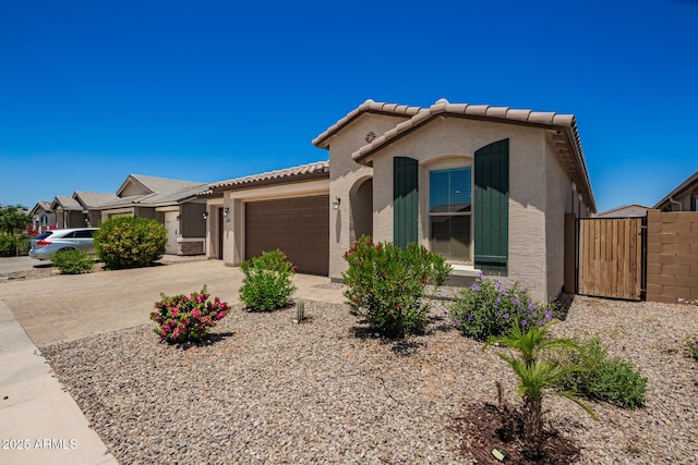 40470 W Agave Rd, Maricopa, AZ 85138 - view of front of house with a tiled roof, a garage, stucco siding, and driveway