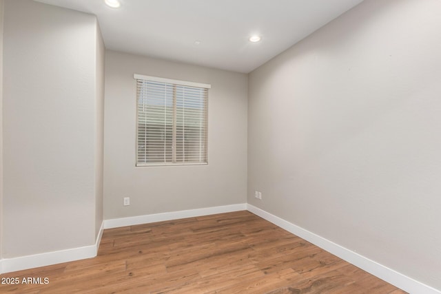 40470 W Agave Rd, Maricopa, AZ 85138 - spare room featuring recessed lighting, baseboards, and light wood finished floors