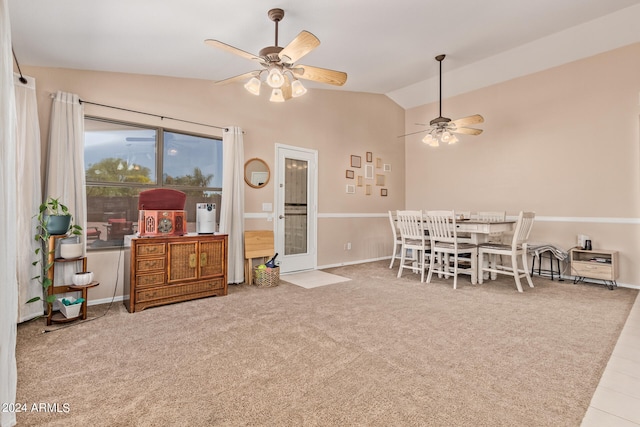 interior space featuring carpet, ceiling fan, and vaulted ceiling