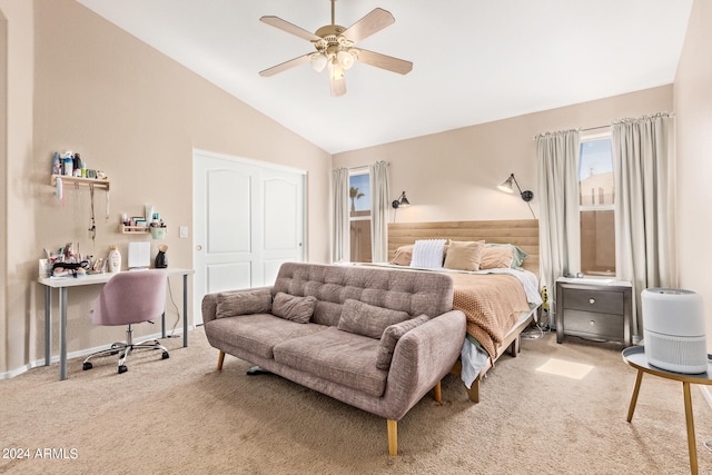 carpeted bedroom featuring lofted ceiling and ceiling fan