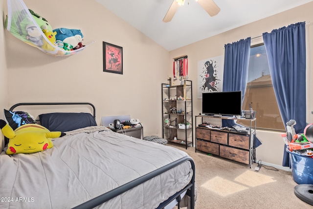 carpeted bedroom featuring lofted ceiling and ceiling fan