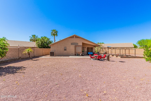 rear view of house with a patio