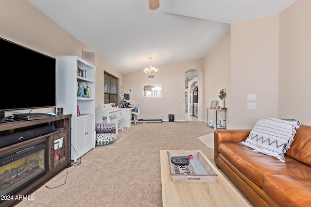 carpeted living room with vaulted ceiling and an inviting chandelier