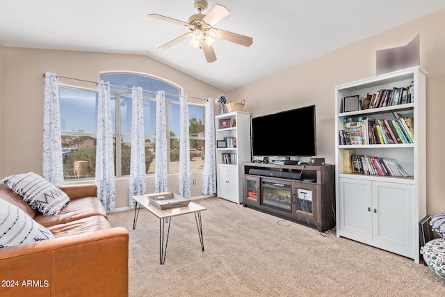 carpeted living room featuring plenty of natural light, ceiling fan, and lofted ceiling