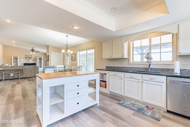 kitchen with light wood-style floors, white cabinets, dishwasher, open shelves, and a raised ceiling