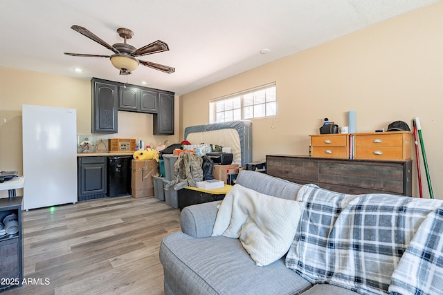 interior space with light wood finished floors and a ceiling fan