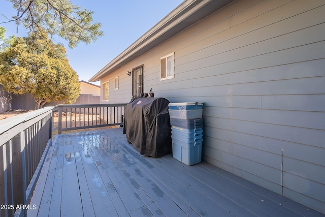 wooden deck featuring fence and grilling area