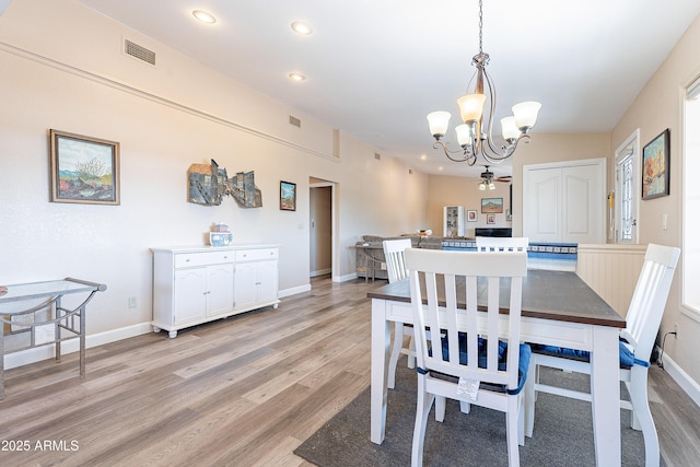 dining area featuring light wood finished floors, recessed lighting, visible vents, and baseboards