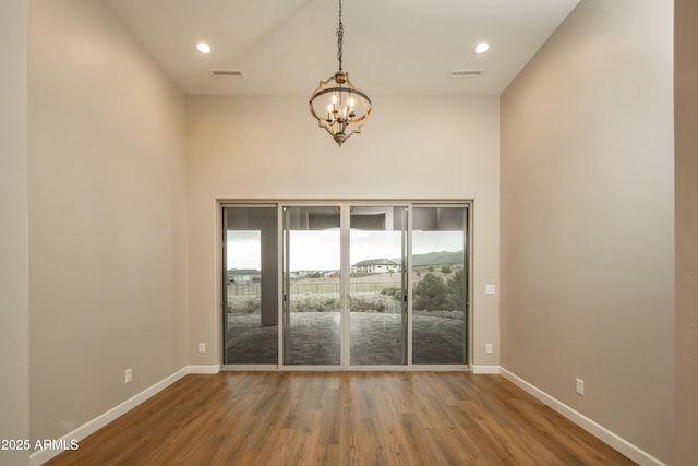14110 E Hard Rock Rd, Prescott Valley, AZ 86315 - spare room with a chandelier, wood finished floors, baseboards, recessed lighting, and a high ceiling