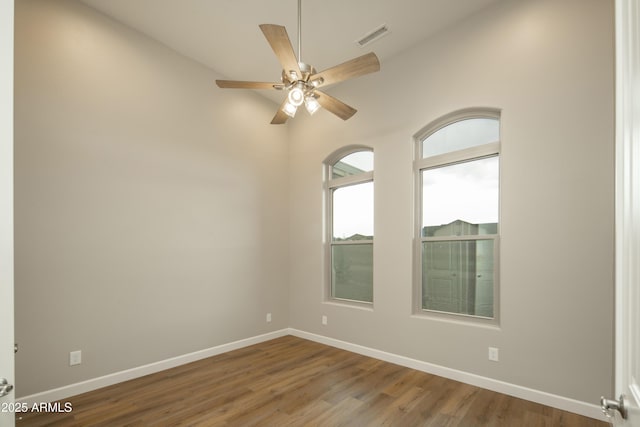 14110 E Hard Rock Rd, Prescott Valley, AZ 86315 - unfurnished room featuring lofted ceiling, wood finished floors, baseboards, and a ceiling fan