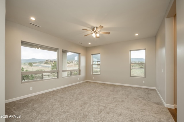 14110 E Hard Rock Rd, Prescott Valley, AZ 86315 - carpeted empty room featuring plenty of natural light, ceiling fan, baseboards, and recessed lighting